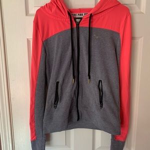Pink zipped up hoodie.